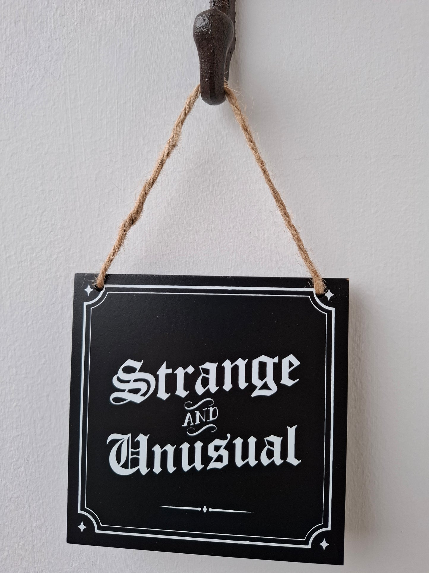 Strange and Unusual Small Sign