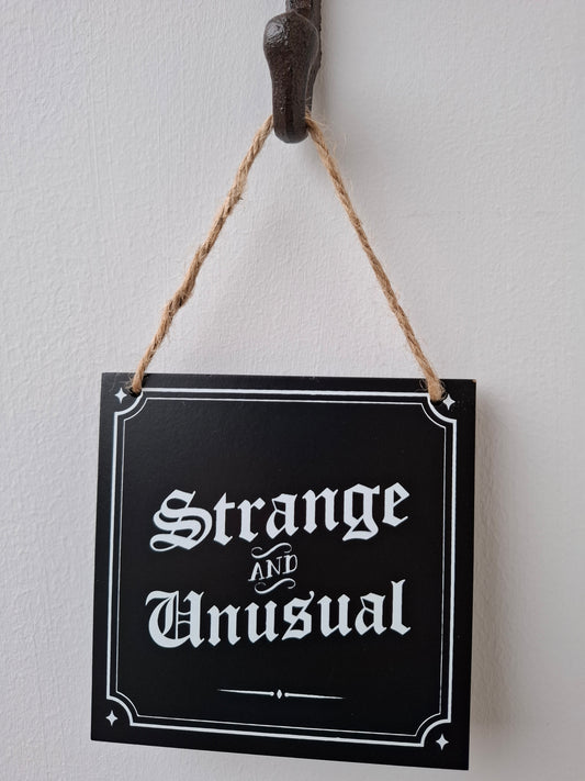 Strange and Unusual Small Sign