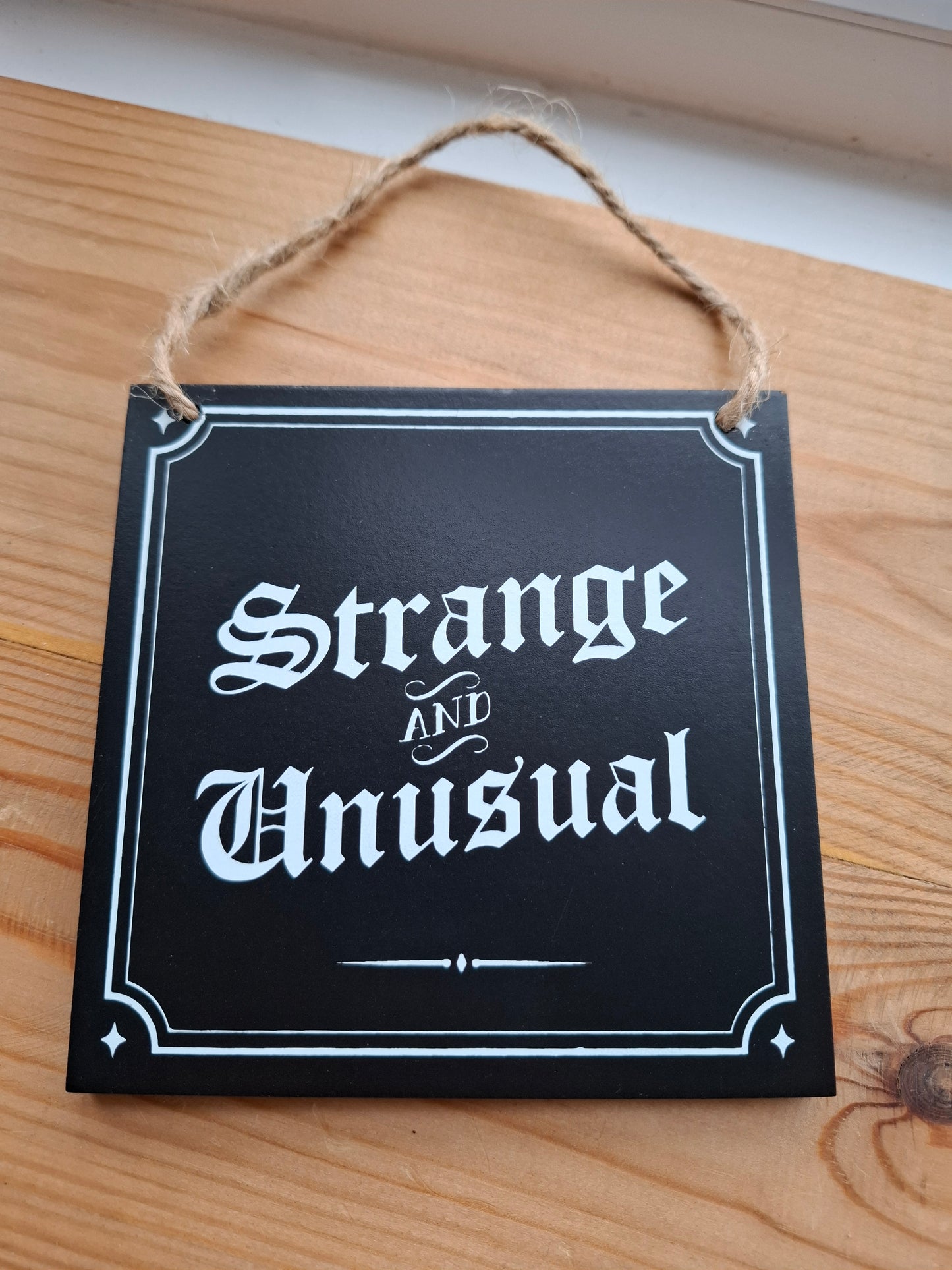Strange and Unusual Small Sign