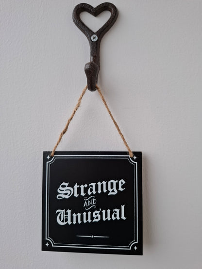Strange and Unusual Small Sign